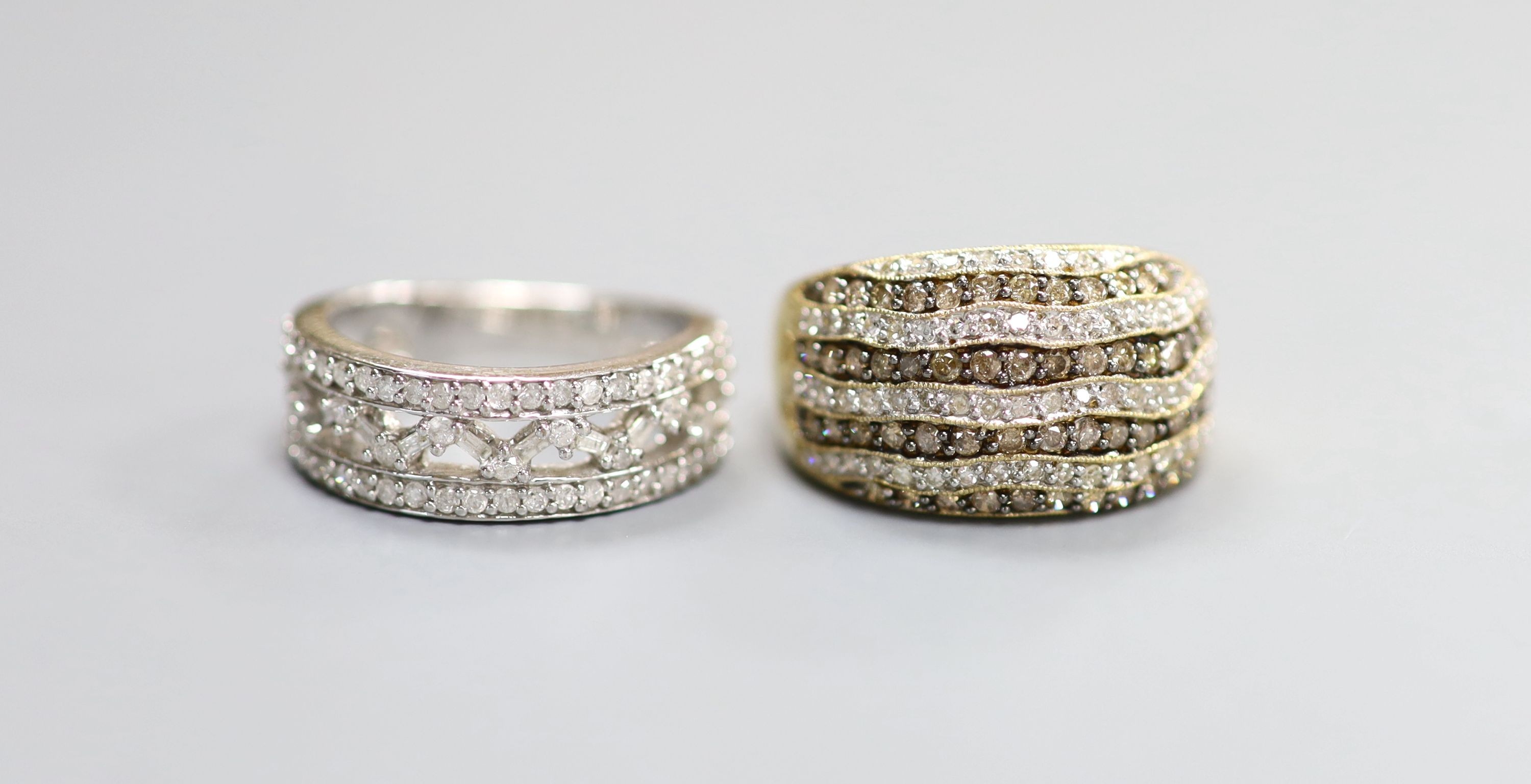 Two modern 9ct gold and diamond chip set cluster dress rings including one two colour diamond ring, sizes P & N, gross weight 11.3 grams.